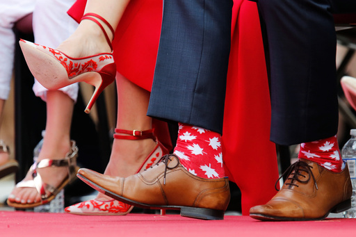 Canada's PM Trudeau wears maple leaf-themed socks during Canada Day celebrations on Parliament Hill in Ottawa