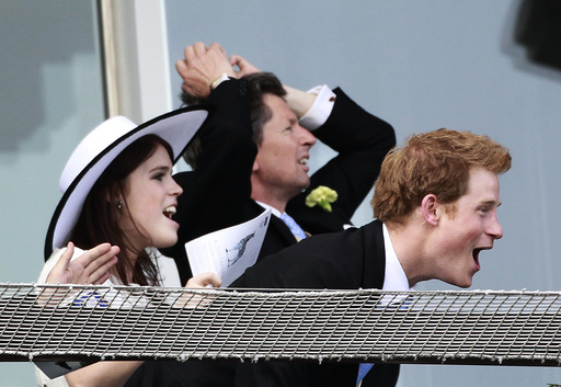 Britain's Princess Eugenie and and Prince Harry watch the Epsom Derby at Epsom Racecourse in southern England
