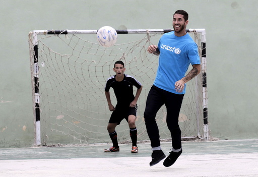 Spain's soccer player and UNICEF ambassador Sergio Ramos plays soccer with Cuban children in Havana