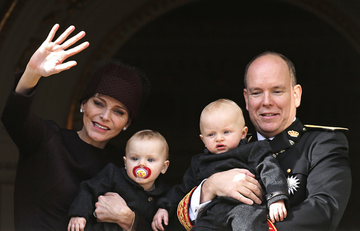 Prince Albert II of Monaco and his wife Princess Charlene hold their twins Prince Jacques and Princess Gabriella as they stand at the Palace Balcony during Monaco's National Day