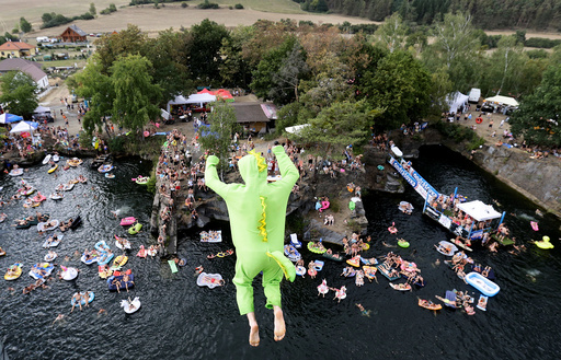 Competitor jumps into the water during a cliff diving competition near the central Bohemian village of Hrimezdice