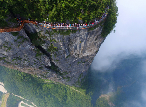 People walk on a sightseeing platform in Zhangjiajie, Hunan Province, China
